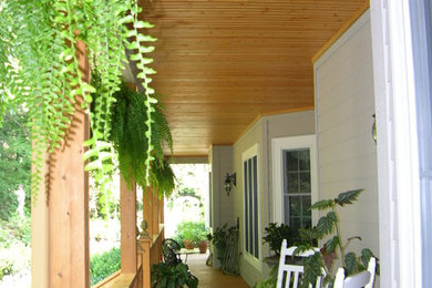 This is an example of a traditional porch design in Charlotte.