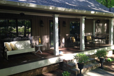 Inspiration for a huge timeless front porch remodel in Atlanta with decking and a roof extension