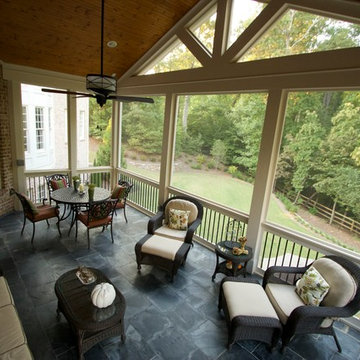 Gable screen porch with tile floor and spiral staircase