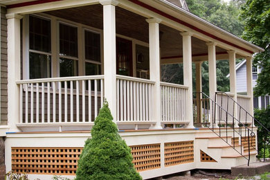 Inspiration for a front porch remodel in Boston with a roof extension