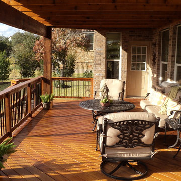 Garapa decking with Oklahoma stone patio and Cedar Pergola