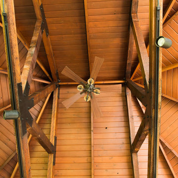Hand-hewn beams with exposed rafters and ceiling