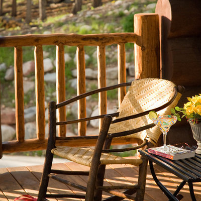 Large mountain style front porch photo in Other with decking and a roof extension