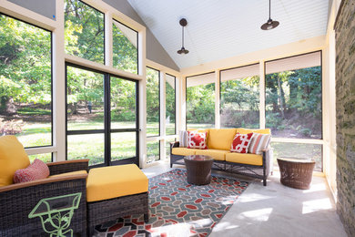 Inspiration for a mid-sized 1960s concrete screened-in back porch remodel in Philadelphia with a roof extension
