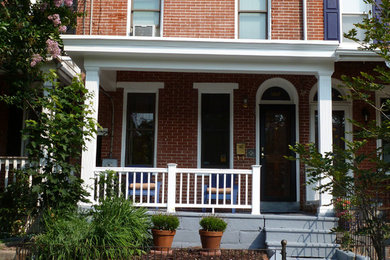 This is an example of a traditional front veranda in Wilmington with concrete slabs.