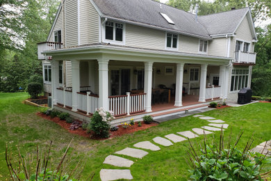 Inspiration for a mid-sized contemporary porch remodel in Bridgeport with decking and a roof extension