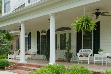 Classic front porch idea in Charlotte with a roof extension