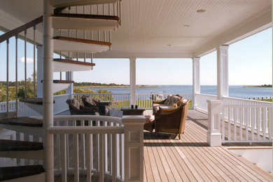 Photo of a beach style veranda in New York.
