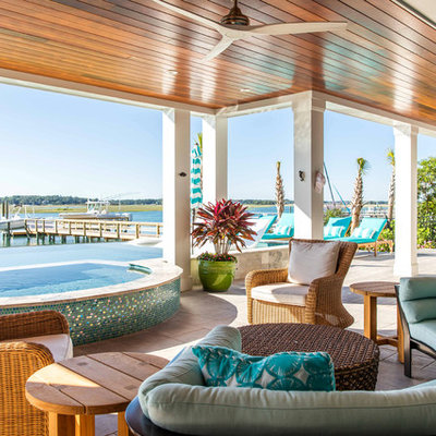 Beach style porch container garden idea in Other with a roof extension