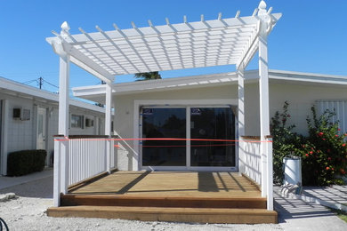This is an example of a coastal porch design in Miami.