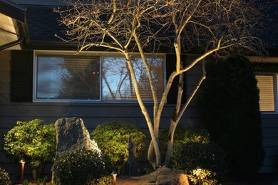 This is an example of a medium sized contemporary front veranda in Seattle with concrete slabs.