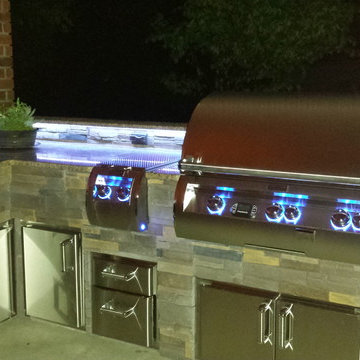 L Shaped Outdoor Kitchen With Unique Lighting