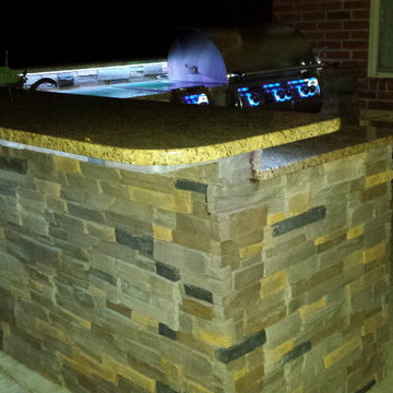 L Shaped Outdoor Kitchen With Unique Lighting