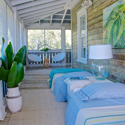 Beach style porch photo in Jacksonville with a roof extension