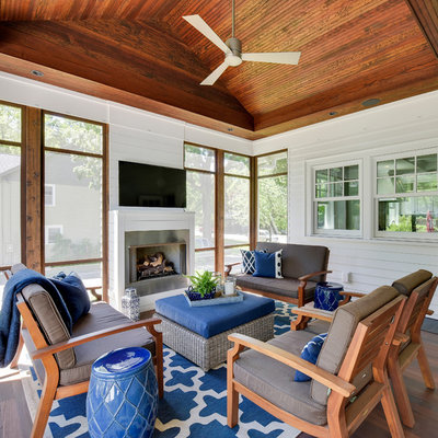 Mid-sized beach style screened-in side porch idea in Minneapolis with decking and a roof extension