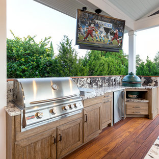 Large transitional porch idea in Other with a roof extension and decking