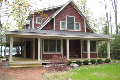 Mid-sized cottage screened-in front porch photo in Other with a roof extension