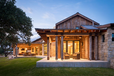 Mountain style porch idea in Austin with a roof extension