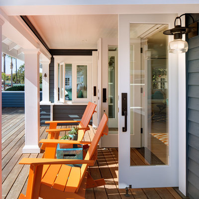 Mid-sized beach style front porch photo in San Diego with decking and a roof extension