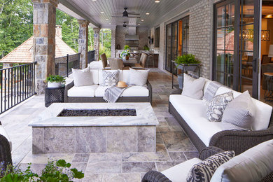 This is an example of a coastal porch design in Atlanta.