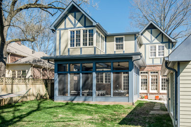 Mid-sized classic concrete screened-in back porch idea in Nashville with a roof extension