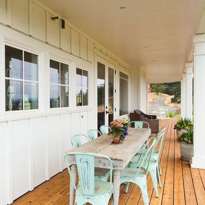 Large country front porch photo in Portland with decking and a roof extension