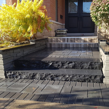 Modern front entrance with natural stone steps & porcelain tiles on the porch