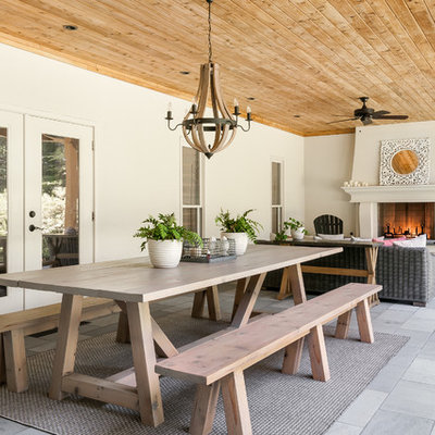 Farmhouse porch idea in Atlanta with a fire pit and a roof extension