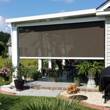 Motorized porch shades