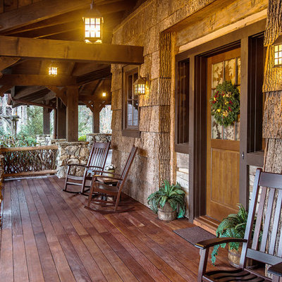 Large mountain style front porch idea in Other with decking and a roof extension