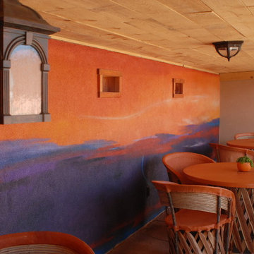 Mural painted on tasting area wall to imitate New Mexico sunset.