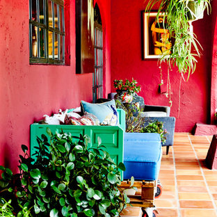 This is an example of an eclectic porch design in New York.