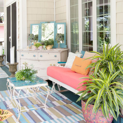 Large eclectic side porch idea in Cleveland with decking and a roof extension