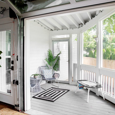 Cottage screened-in back porch photo in Nashville with decking and a roof extension