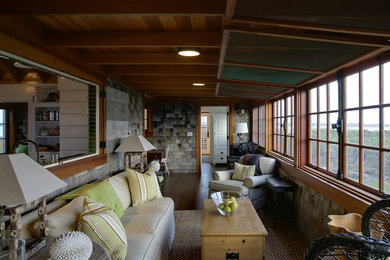 Design ideas for a nautical veranda in Boston with a roof extension and feature lighting.