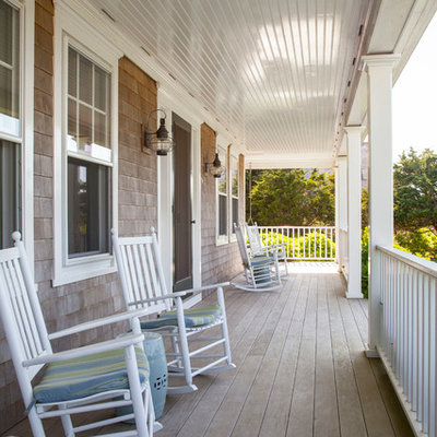 Large beach style front porch photo in Boston with decking and a roof extension