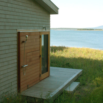 Mid-sized trendy side porch idea in Portland Maine with decking and a roof extension