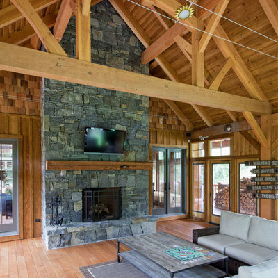 Inspiration for a mid-sized rustic side porch remodel in Burlington with a fire pit, decking and a roof extension