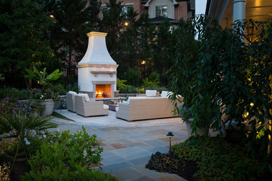 Example of a transitional patio design in DC Metro with a fire pit