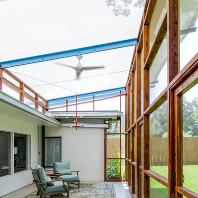 Trendy porch photo in Austin with a roof extension