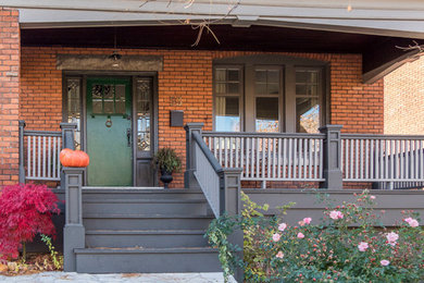 Inspiration for a mid-sized timeless front porch remodel in Toronto with decking and a roof extension