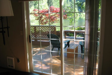 This is an example of a small transitional back porch design in Seattle with decking.