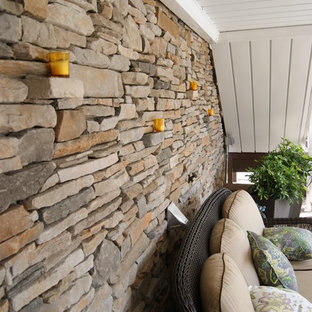 This is an example of an eclectic porch design in New York.