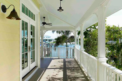 Design ideas for a classic veranda in Tampa with decking and a roof extension.