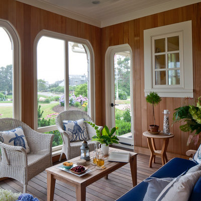 Mid-sized beach style screened-in side porch photo in Boston with decking and a roof extension