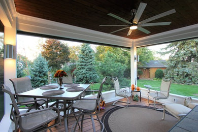 Mid-sized trendy screened-in back porch photo in Other with decking and a roof extension