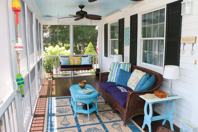 Inspiration for a mid-sized timeless front porch remodel in Boston with decking and a roof extension