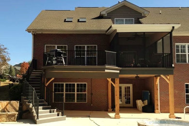 Screened-in back porch photo in Other with a roof extension