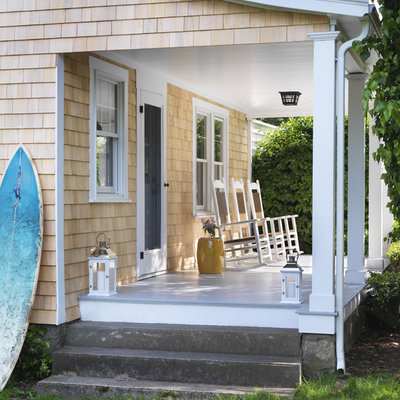 Beach style porch idea in Providence with decking and a roof extension