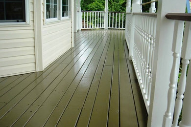 Mid-sized classic back porch idea in New York with decking and a roof extension